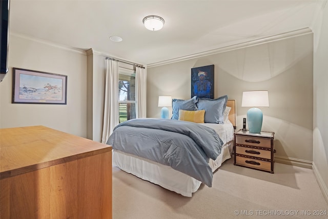 carpeted bedroom featuring crown molding