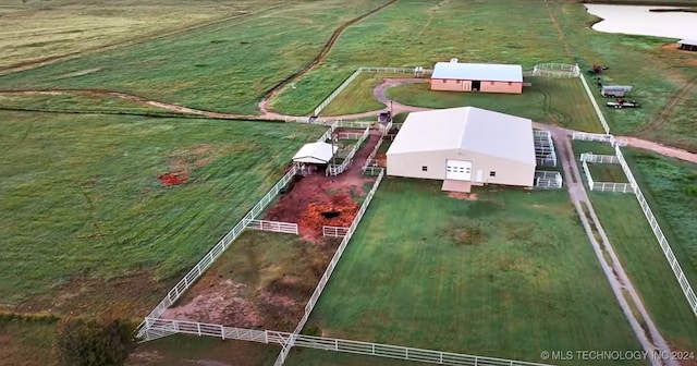 birds eye view of property with a rural view