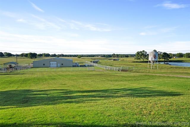 view of yard with a water view and a rural view