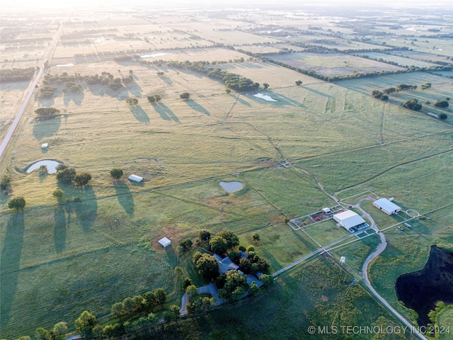 birds eye view of property featuring a rural view