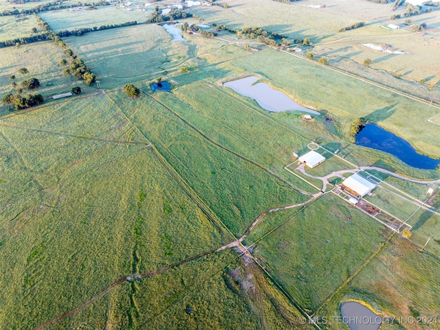 bird's eye view featuring a water view and a rural view