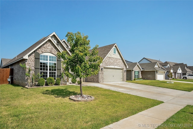 view of front facade featuring a front yard and a garage