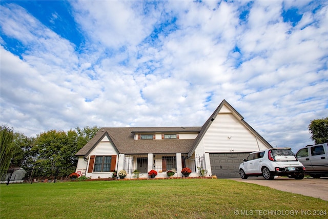 view of front facade featuring a garage, a front yard, roof with shingles, and concrete driveway