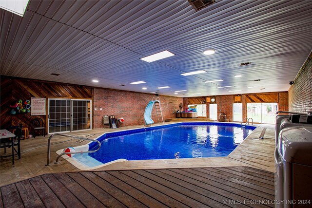 view of pool with a water slide