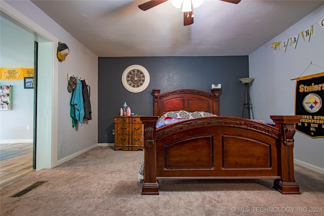 carpeted bedroom with ceiling fan