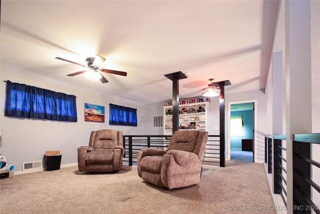 living room featuring ceiling fan and carpet flooring