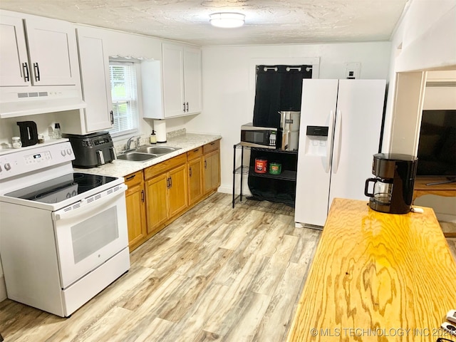 kitchen featuring light wood-type flooring, white appliances, exhaust hood, sink, and white cabinets