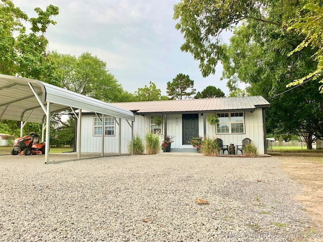 ranch-style home featuring a carport