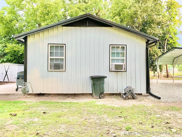 view of outbuilding with a yard