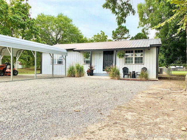 single story home featuring a carport