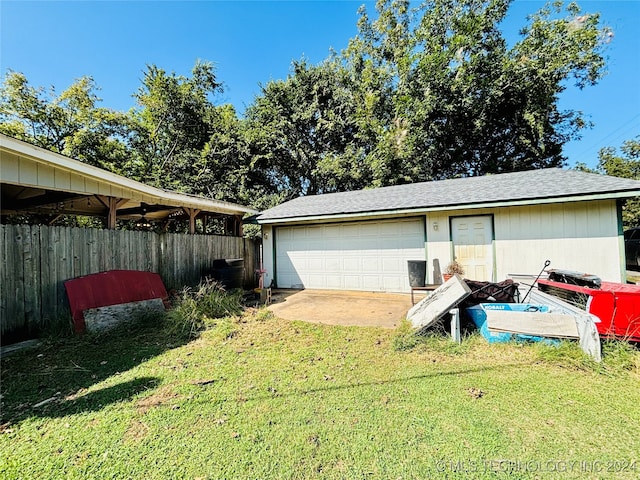 garage with a yard