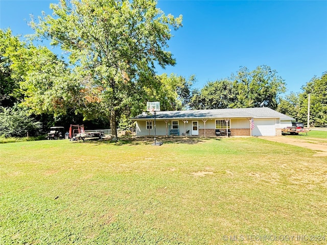 exterior space with a yard and a garage