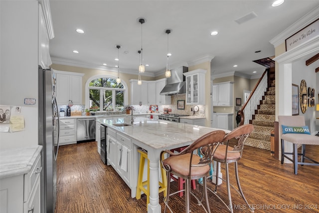 kitchen featuring wall chimney exhaust hood, white cabinets, an island with sink, and dark hardwood / wood-style floors