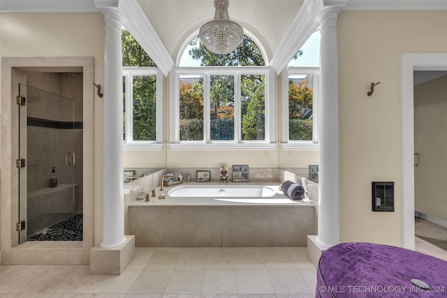 bathroom featuring plus walk in shower, tile patterned flooring, a textured ceiling, and a healthy amount of sunlight