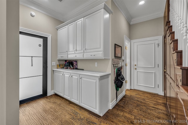 kitchen featuring ornamental molding, white cabinetry, and dark hardwood / wood-style floors