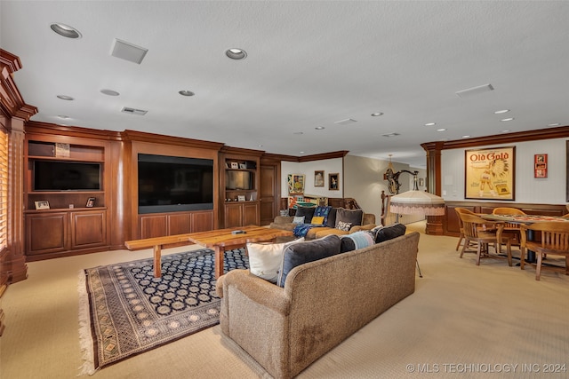 carpeted living room featuring ornate columns, a textured ceiling, and crown molding