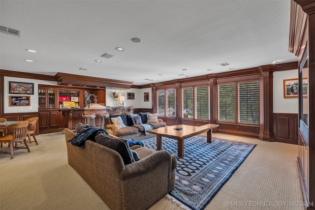 living room with light carpet, a textured ceiling, and crown molding