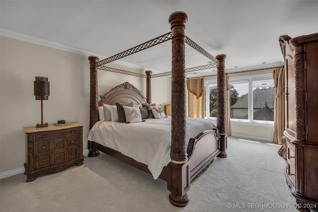 carpeted bedroom with crown molding