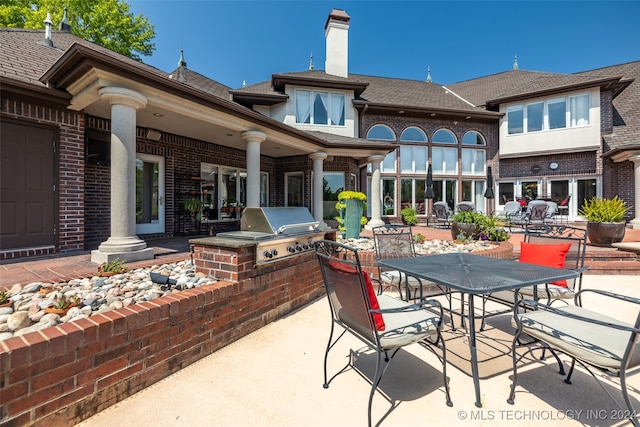 view of patio / terrace featuring area for grilling and an outdoor kitchen