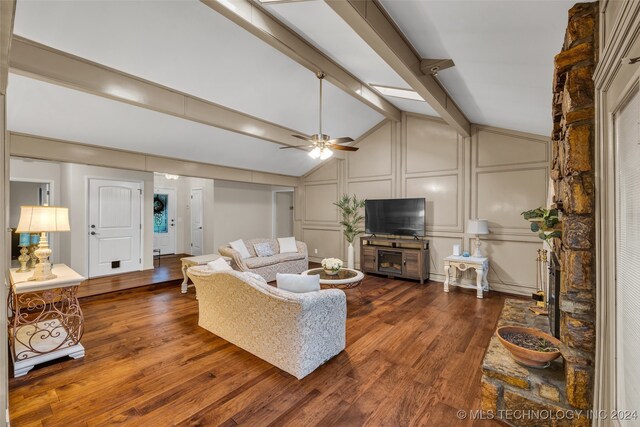 living room featuring vaulted ceiling with beams, ceiling fan, and dark hardwood / wood-style flooring