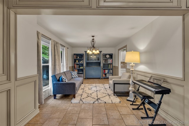 living area featuring a notable chandelier