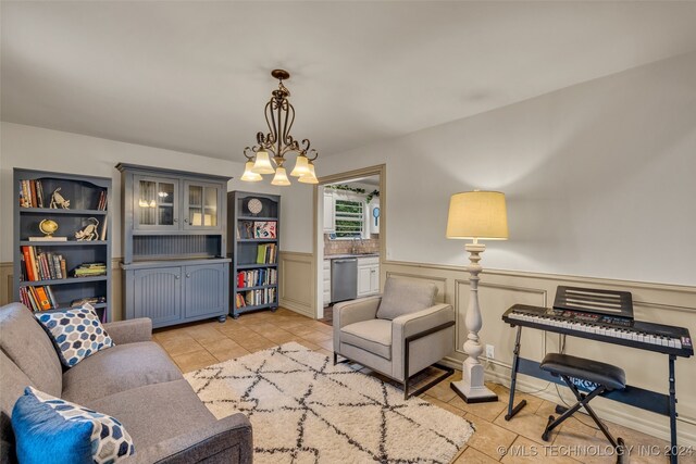 living room featuring an inviting chandelier and light tile patterned floors