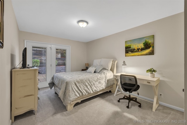 carpeted bedroom with access to outside