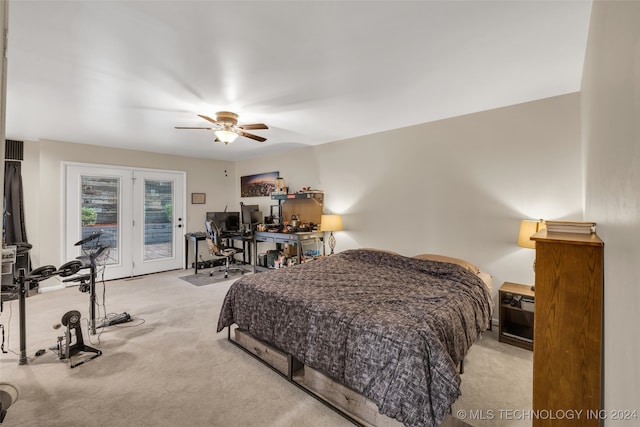 carpeted bedroom featuring french doors, access to outside, and ceiling fan