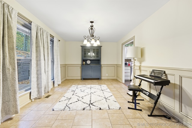 tiled dining area with a notable chandelier