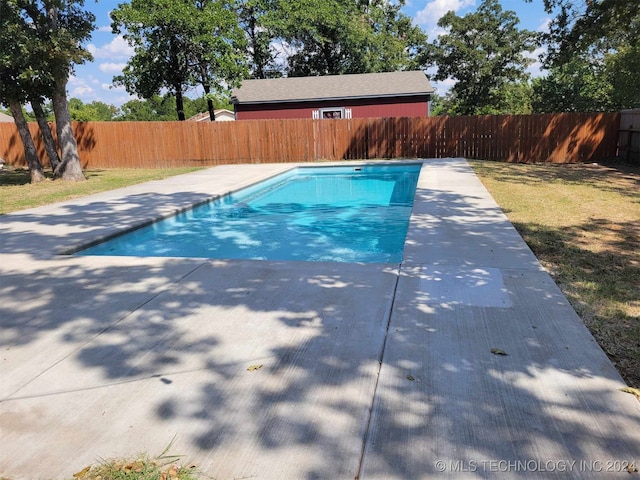 view of swimming pool with a patio area