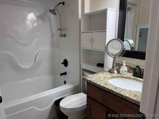 full bathroom with vanity, toilet, and  shower combination