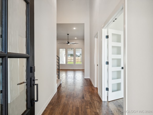 corridor featuring dark hardwood / wood-style floors