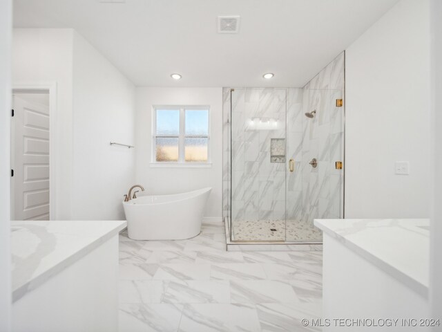 bathroom featuring plus walk in shower and vanity