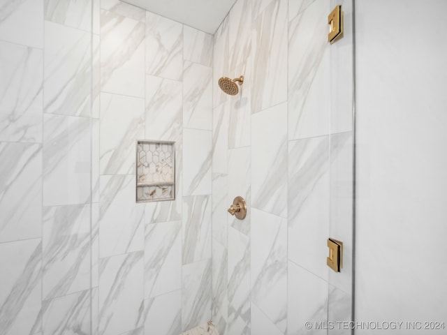 room details with a tile shower