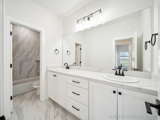 full bathroom featuring vanity, toilet, and tiled shower / bath combo