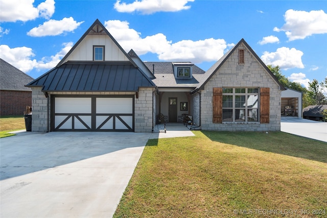 view of front of home featuring a front yard and a garage