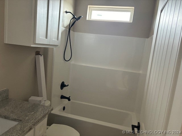 full bathroom with shower / bath combination, vanity, and toilet