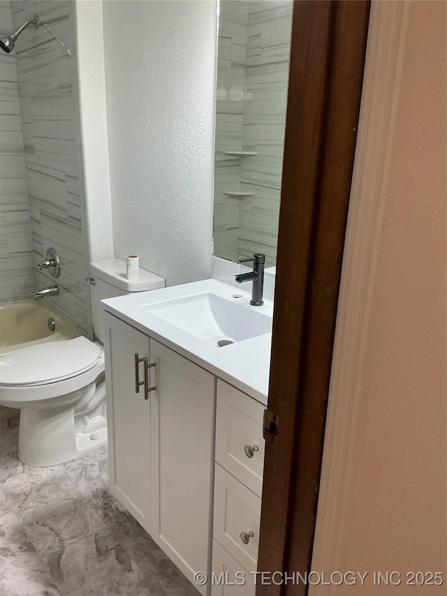 bathroom with toilet, a textured wall, shower / bathing tub combination, and vanity