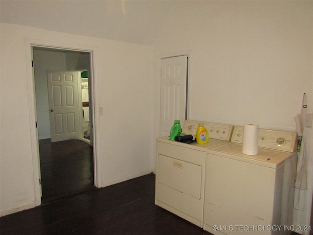 clothes washing area featuring independent washer and dryer and dark hardwood / wood-style flooring