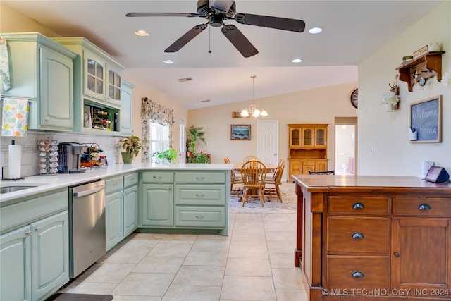 kitchen featuring lofted ceiling, hanging light fixtures, kitchen peninsula, dishwasher, and ceiling fan with notable chandelier