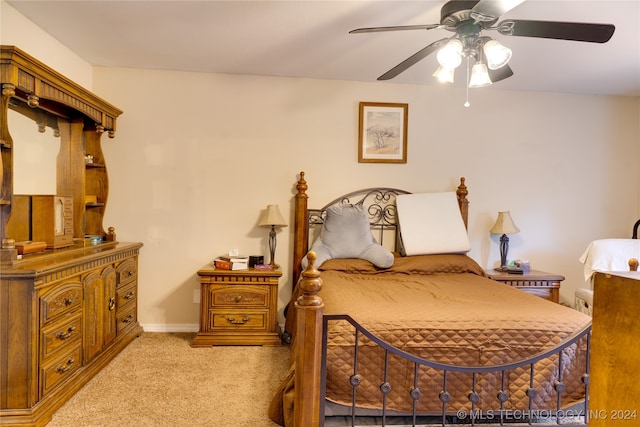 bedroom with light carpet and ceiling fan