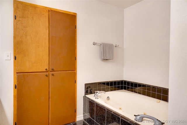 bathroom with tiled tub