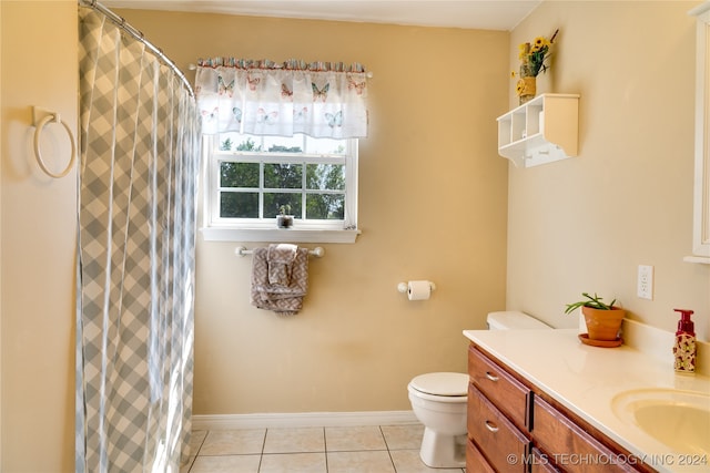 bathroom featuring a shower with curtain, vanity, toilet, and tile patterned floors