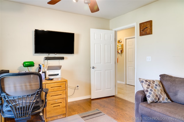 office space with hardwood / wood-style floors and ceiling fan