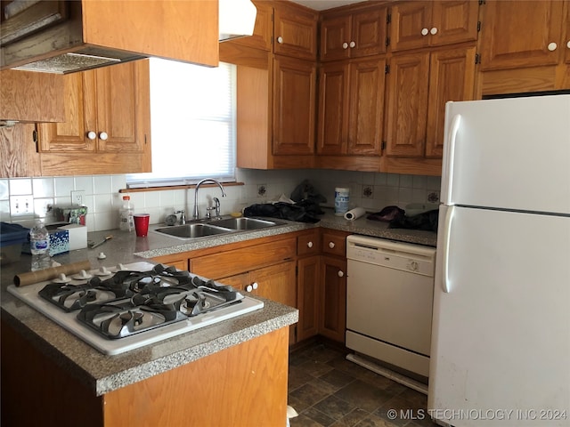 kitchen featuring white appliances, sink, exhaust hood, and tasteful backsplash