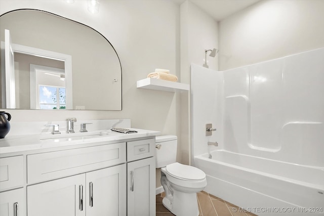 full bathroom featuring tile patterned floors,  shower combination, vanity, and toilet