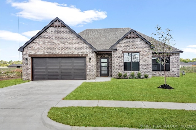 27915 E 109th Pl S, Coweta, OK 74429 - french country home featuring brick siding, a front yard, and driveway