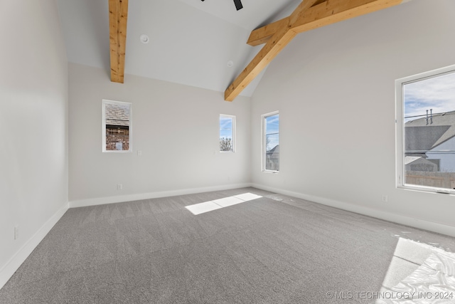 carpeted spare room featuring ceiling fan, beam ceiling, and high vaulted ceiling