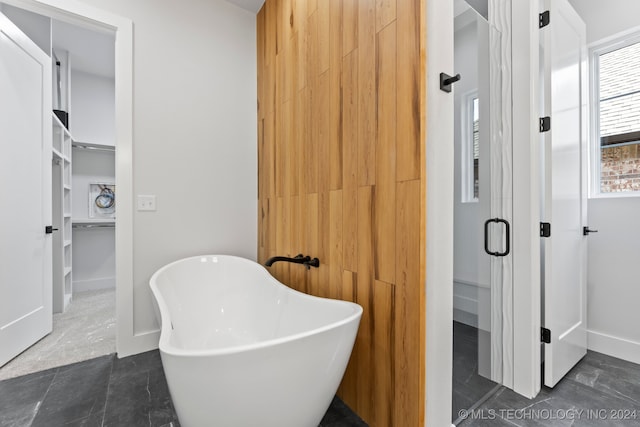 bathroom featuring separate shower and tub and tile patterned floors