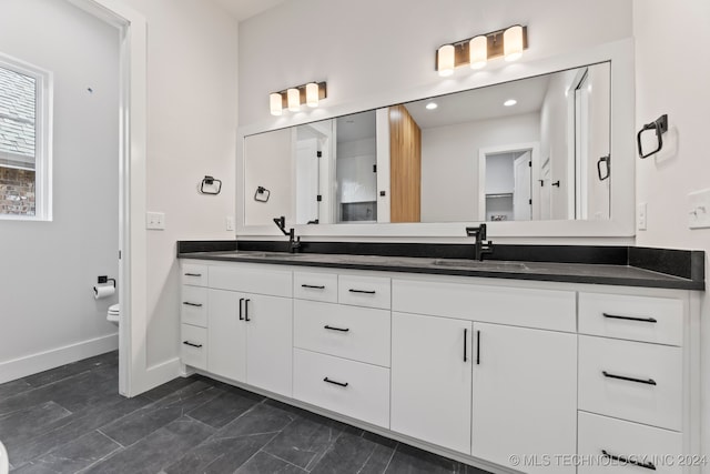 bathroom with vanity and toilet